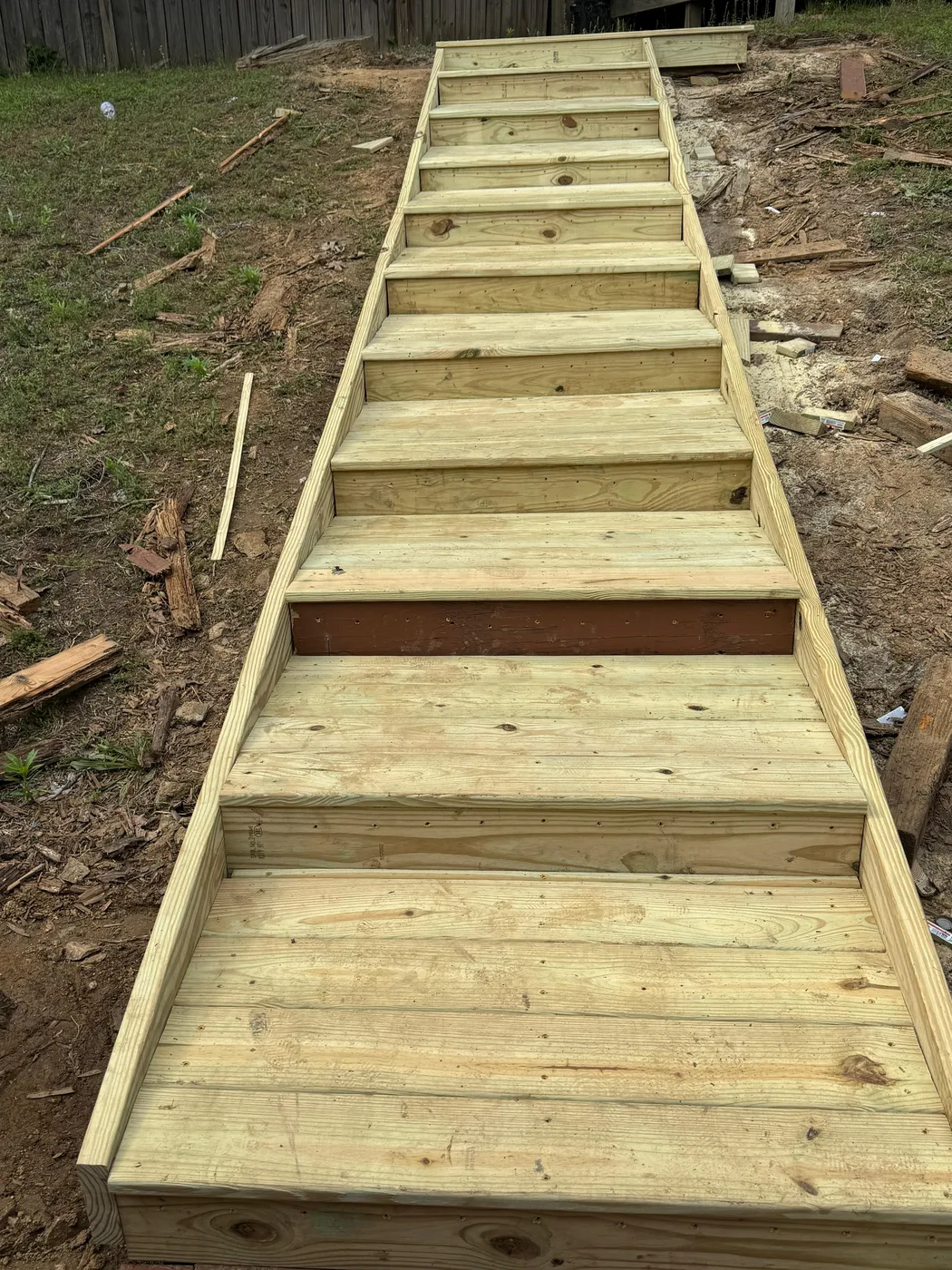 New pressure-treated deck stairs freshly built