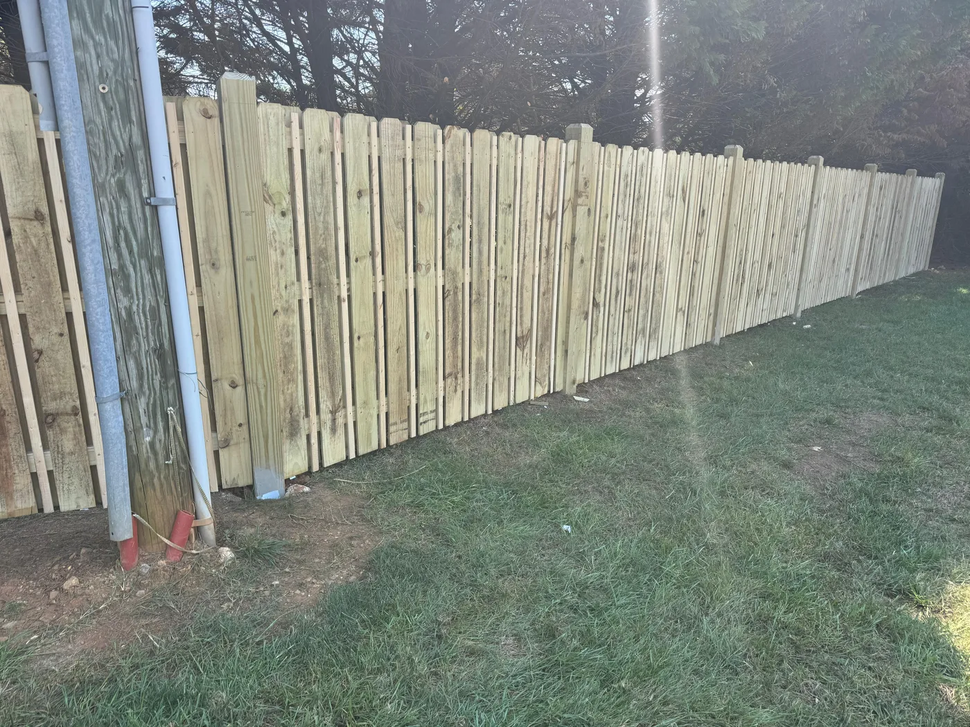 New wood privacy fence on solid posts