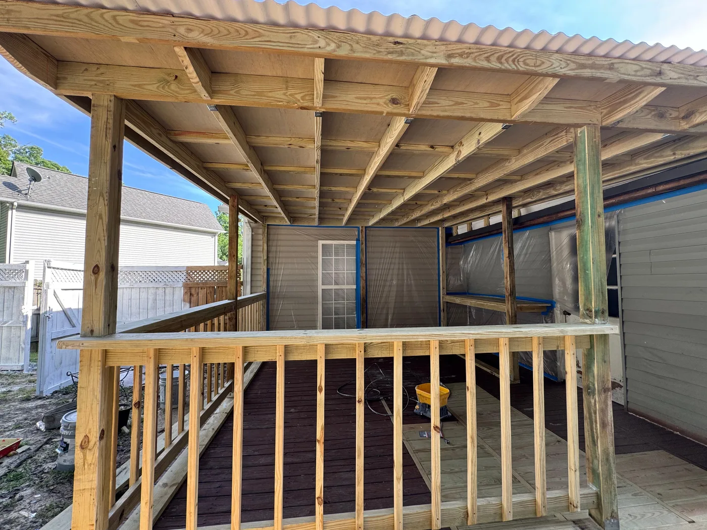 Pergola framing going up over a new deck