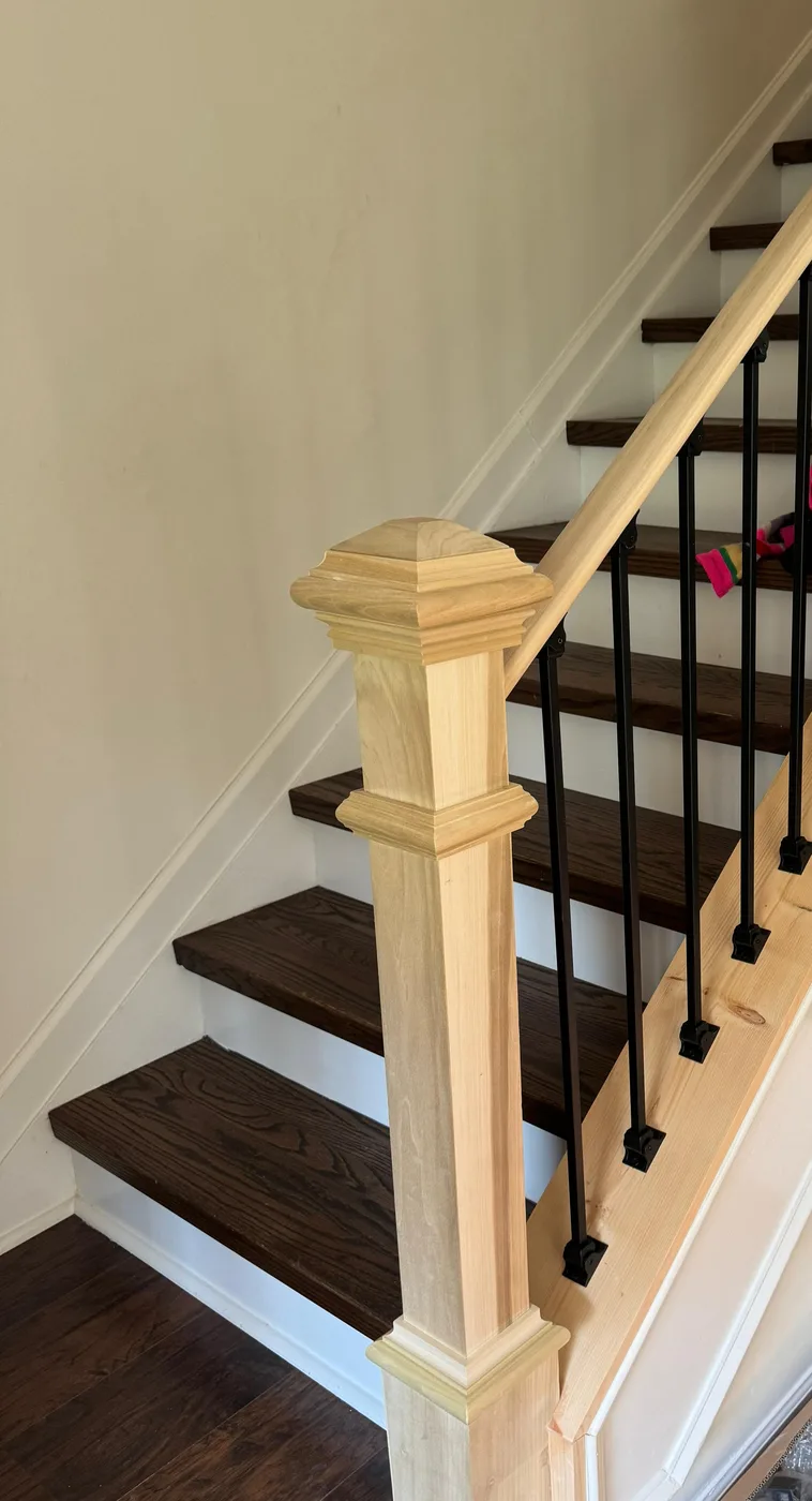 Staircase upgraded with iron balusters and refinished treads